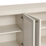 Uniquely made from ivory-painted linen, a beautifully curved sideboard gives shape to generous storage for dinnerware, linens and more Amethyst Home provides interior design, new home construction design consulting, vintage area rugs, and lighting in the Tampa metro area.