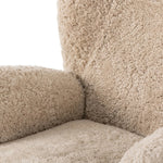 Relax into the curved arms and subtle wingback shape of this classic reading chair, featuring a reclining mechanism for ultimate comfort. Upholstered in an ethically sourced, natural beige shearling for extra comfort and texture. Crafted with S-spring suspension, a loose cushion and hidden legs beneath. Amethyst Home provides interior design, new home construction design consulting, vintage area rugs, and lighting in the Nashville metro area.