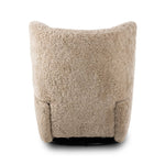 Relax into the curved arms and subtle wingback shape of this classic reading chair, featuring a reclining mechanism for ultimate comfort. Upholstered in an ethically sourced, natural beige shearling for extra comfort and texture. Crafted with S-spring suspension, a loose cushion and hidden legs beneath. Amethyst Home provides interior design, new home construction design consulting, vintage area rugs, and lighting in the San Diego metro area.