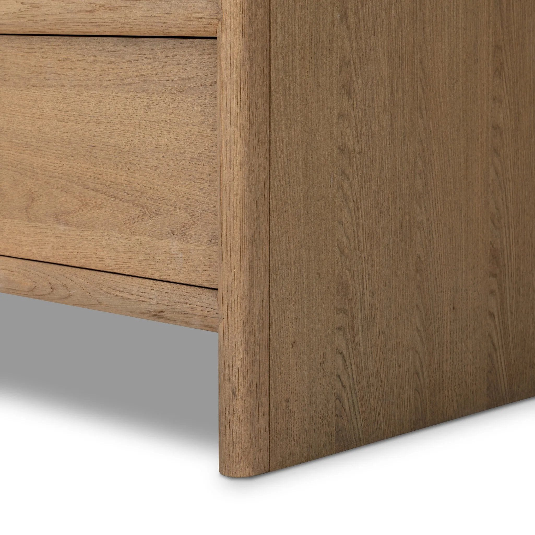 Crafted from sandy solid oak in a waterfall silhouette, this dresser adds a touch of contemporary simplicity to your bedroom. A bullnose edge and oval iron drawer pulls add variety.As lovers of natural design at Amethyst, we love the designer inspired Analisa 6 Drawer Dresser - Sandy Oak. Amethyst Home provides interior design, new home construction design consulting, vintage area rugs, and lighting in the Dallas metro area.