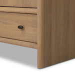 Crafted from sandy solid oak in a waterfall silhouette, this armoire adds a touch of contemporary simplicity to your bedroom. Double doors open to spacious shelving, complemented by a bottom drawer for extra storage. The piece’s bullnose edge and oval iron hardware add variety. Amethyst Home provides interior design, new home construction design consulting, vintage area rugs, and lighting in the San Diego metro area.