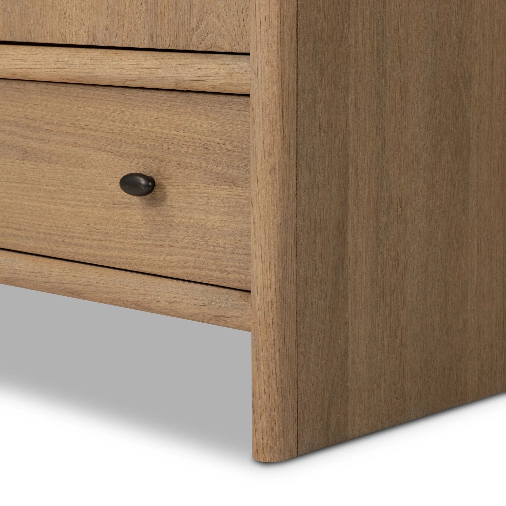 Crafted from sandy solid oak in a waterfall silhouette, this armoire adds a touch of contemporary simplicity to your bedroom. Double doors open to spacious shelving, complemented by a bottom drawer for extra storage. The piece’s bullnose edge and oval iron hardware add variety. Amethyst Home provides interior design, new home construction design consulting, vintage area rugs, and lighting in the San Diego metro area.