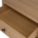 Crafted from sandy solid oak in a waterfall silhouette, this nightstand adds a touch of contemporary simplicity to the bedside. Stack your favorite books on a spacious bottom shelf. The piece’s bullnose edge and oval iron drawer pull add variety. Amethyst Home provides interior design, new home construction design consulting, vintage area rugs, and lighting in the Los Angeles metro area.