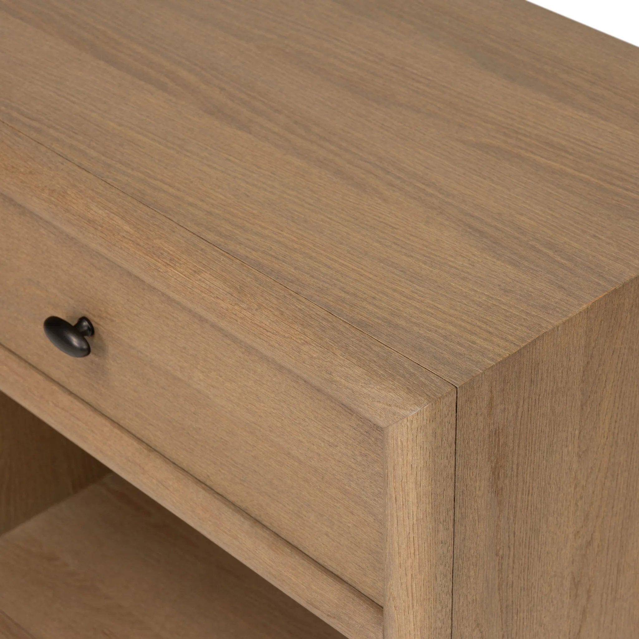 Crafted from sandy solid oak in a waterfall silhouette, this nightstand adds a touch of contemporary simplicity to the bedside. Stack your favorite books on a spacious bottom shelf. The piece’s bullnose edge and oval iron drawer pull add variety. Amethyst Home provides interior design, new home construction design consulting, vintage area rugs, and lighting in the Miami metro area.