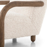 This versatile accent chair is upholstered in a faux Mongolian shearling with a textural high pile. A contrasting, chunky parawood frame hugs the seat and is wire-brushed for a warm, vintage feel.Collection: Kensingto Amethyst Home provides interior design, new home construction design consulting, vintage area rugs, and lighting in the Boston metro area.