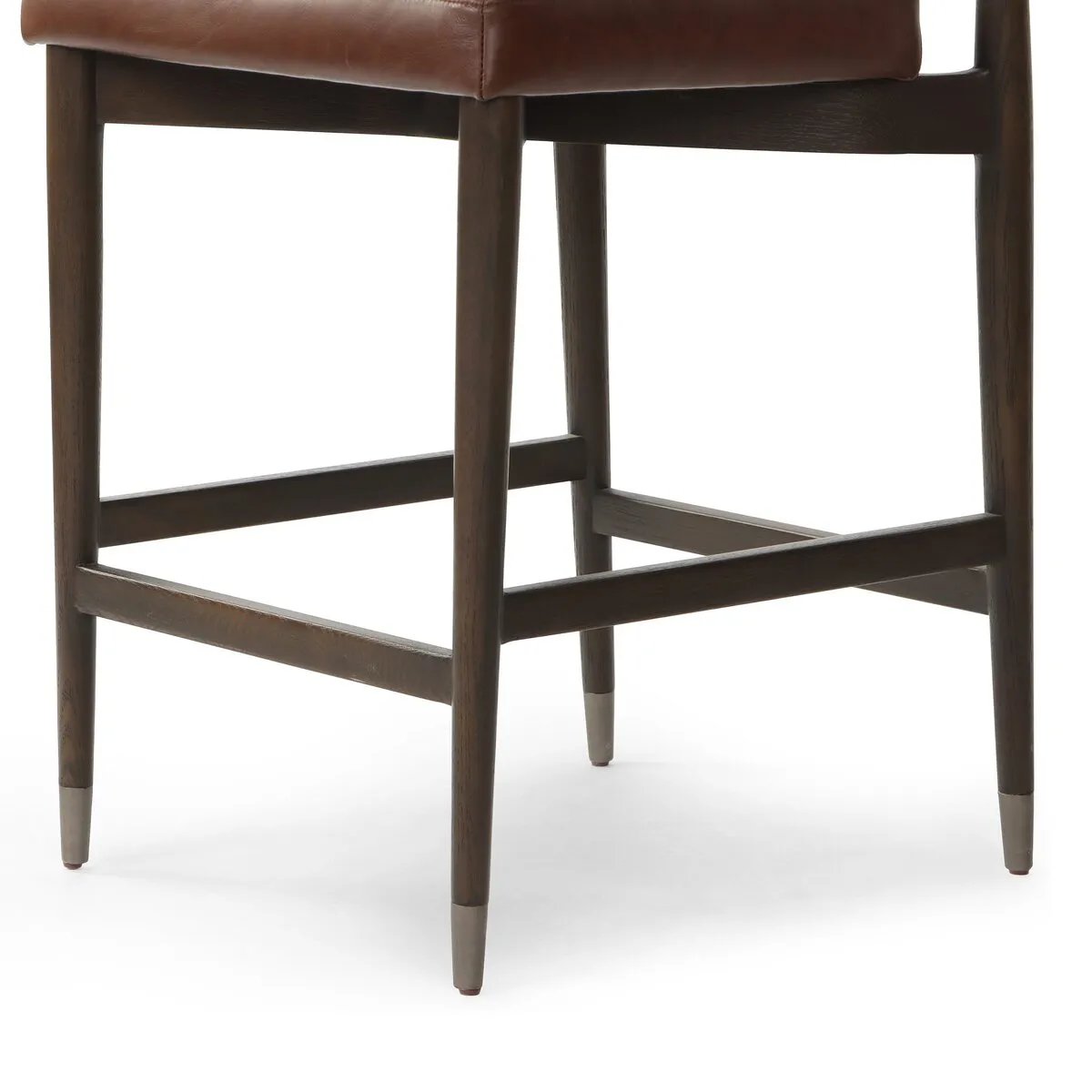 Crafted with a sleek Havana Brown finish, the Anton Bar + Counter Stool adds a touch of elegance to any space. The sturdy construction and ergonomic design provide exceptional support, making it suitable for extended use. Perfect for both bar and counter heights, this versatile stool is sure to enhance your sitting experience. Amethyst Home provides interior design, new home construction design consulting, vintage area rugs, and lighting in the Winter Garden metro area.