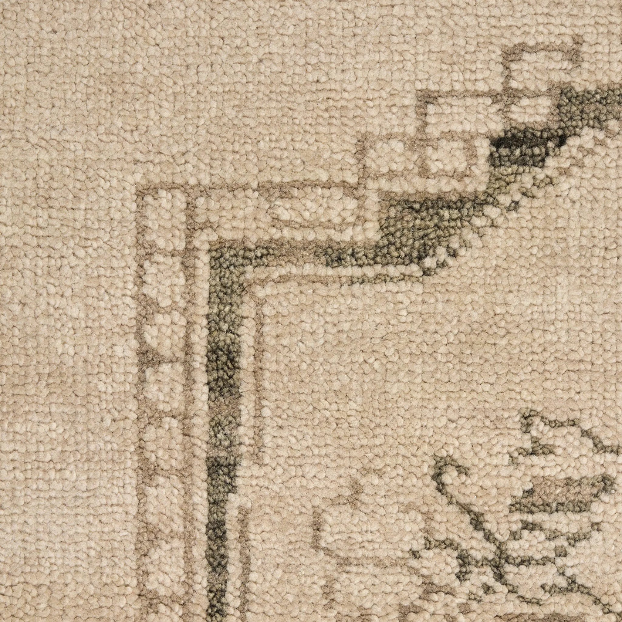 Patterned with a simplistic three-emblem motif framed by a narrow border, this hand-knotted wool rug adds just a touch of neutral design. The durable runner is crafted to wear beautifully over time. Due to the handcrafted nature of this rug, slight variations in sizing may occur Amethyst Home provides interior design, new home construction design consulting, vintage area rugs, and lighting in the Washington metro area.