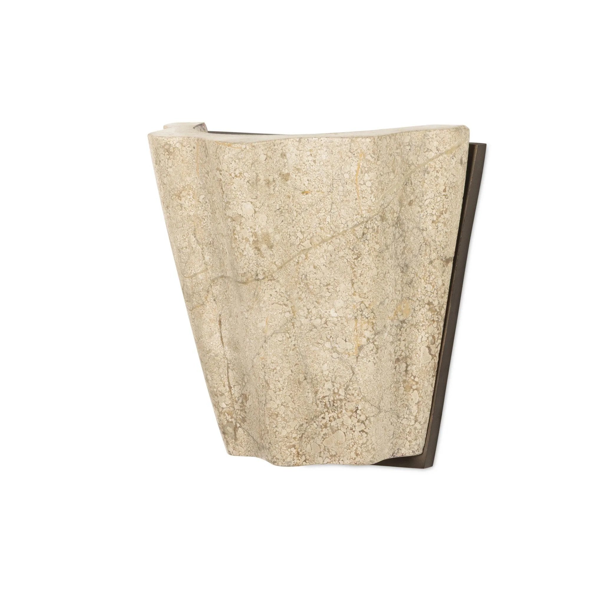 Turned Italian marble in a curved scalloped shape directs the light beautifully. The sculpted stone's organic tones and brushed brass iron back plating make for high-quality, décor-driven detail Amethyst Home provides interior design, new home construction design consulting, vintage area rugs, and lighting in the Dallas metro area.