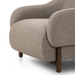 Featuring Audrey Weslie Feather Chair by Four Hands at Amethyst Home. This elevated arm chair features a clean top piece that partially overlaps its bottom counterpart and seamlessly blends the back cushion into the armrests in one fluid form. The seat's legs appear to extend from the seat and back, adding architectural interest. Upholstered in a recycled Turki. Amethyst Home provides interior design, new home construction design consulting, vintage area rugs, and lighting in the Tampa metro area.