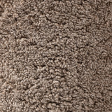 Intriguing while inviting, drum-style seating is upholstered in a soft, taupe shearling. A 360-degree swivel base of natural parawood places a fresh spin on a feminine form Amethyst Home provides interior design, new home construction design consulting, vintage area rugs, and lighting in the Austin metro area.