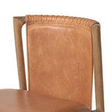 Featuring Baden Haven Tobacco Dining Chair by Four Hands at Amethyst Home. Midcentury-inspired with its minimalist wooden frame, this armless dining chair features a low back and float-like seat upholstered in tobacco top-grain leather exclusive to Four Hands. Leather wrap detailing for texture.Overall Dimensions: 19.75"w x 23.25"d x 32.25"hWeight : 14.99 lbsM. Amethyst Home provides interior design, new home construction design consulting, vintage area rugs, and lighting in the Dallas metro area.