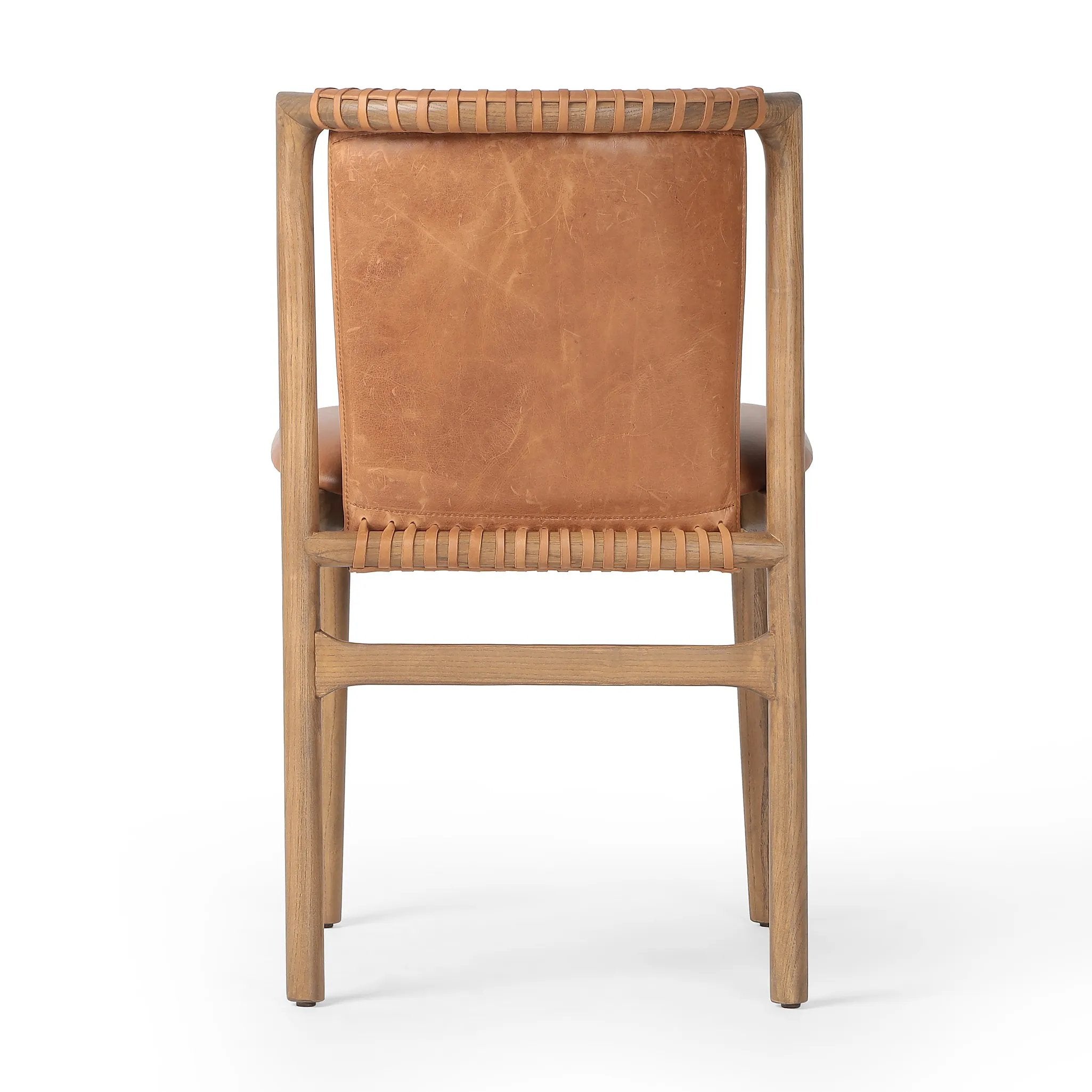 Featuring Baden Haven Tobacco Dining Chair by Four Hands at Amethyst Home. Midcentury-inspired with its minimalist wooden frame, this armless dining chair features a low back and float-like seat upholstered in tobacco top-grain leather exclusive to Four Hands. Leather wrap detailing for texture.Overall Dimensions: 19.75"w x 23.25"d x 32.25"hWeight : 14.99 l. Amethyst Home provides interior design, new home construction design consulting, vintage area rugs, and lighting in the Nashville metro area.