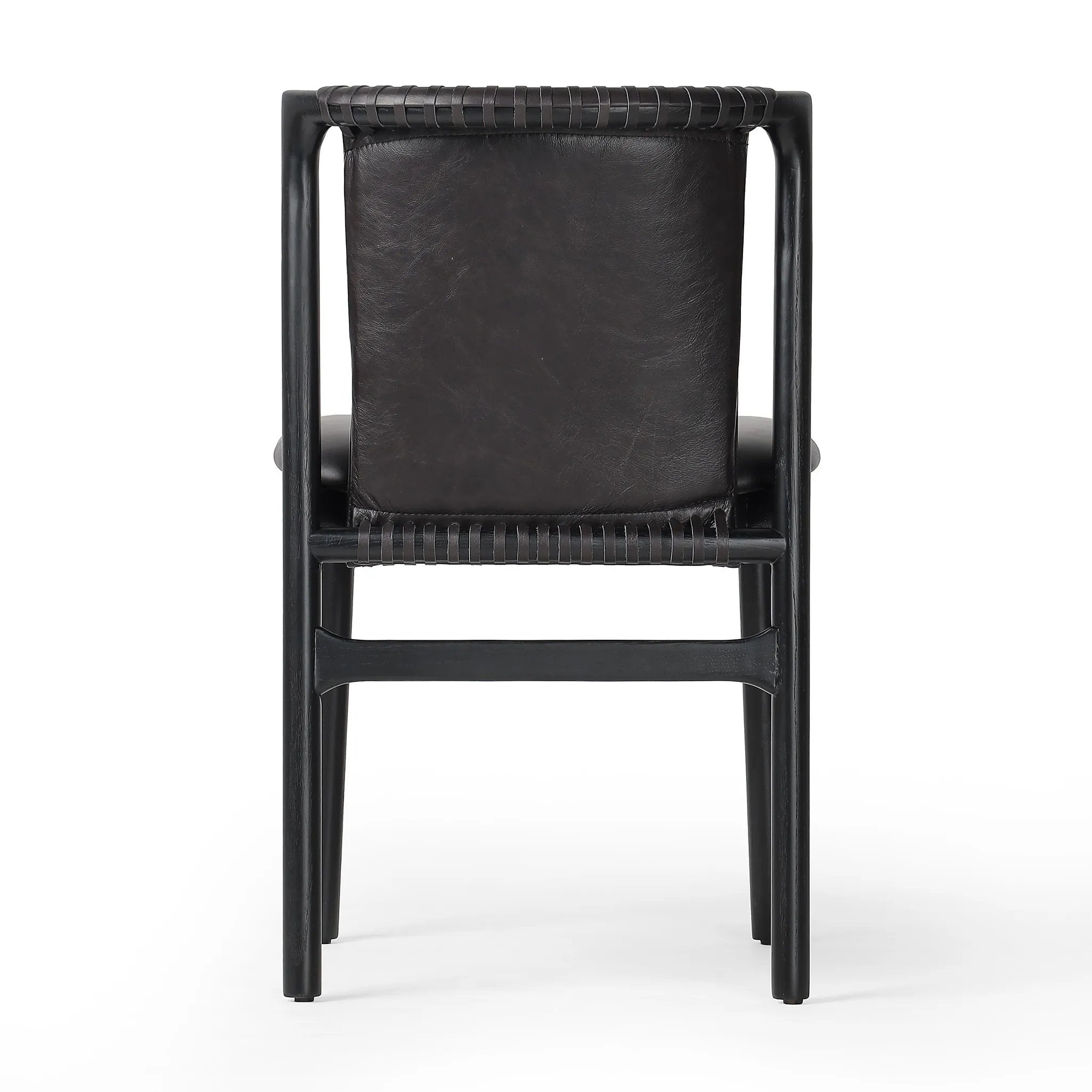 Featuring Baden Sonoma Black Dining Chair by Four Hands at Amethyst Home. Midcentury-inspired with its minimalist wooden frame, this armless dining chair features a low back and float-like seat upholstered in slightly distressed black top-grain leather exclusive to Four Hands. Leather wrap detailing for texture.Overall Dimensions: 19.75"w x 23.25"d x 32.25". Amethyst Home provides interior design, new home construction design consulting, vintage area rugs, and lighting in the San Diego metro area.