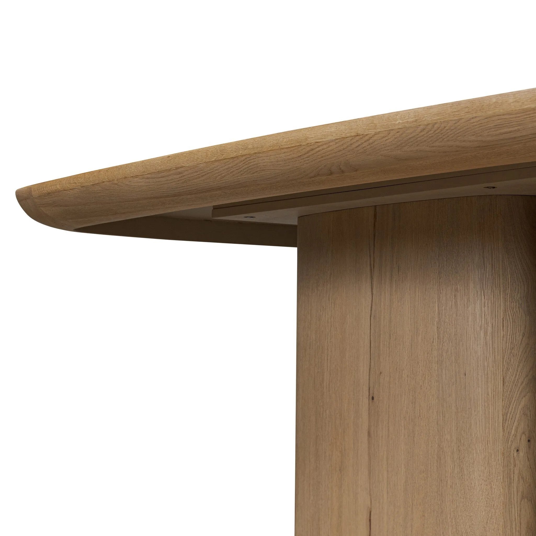 A stately dining style inspired by soft Brutalism. Crafted from aged smoked oak, a pair of matching pedestal bases features a delicate break between them, bringing a touch of lightness to such a substantial piece. A wide rectangular tabletop shapes arched sides that flow into rounded corners, finished off with bullnose edging Amethyst Home provides interior design, new home construction design consulting, vintage area rugs, and lighting in the Boston metro area.