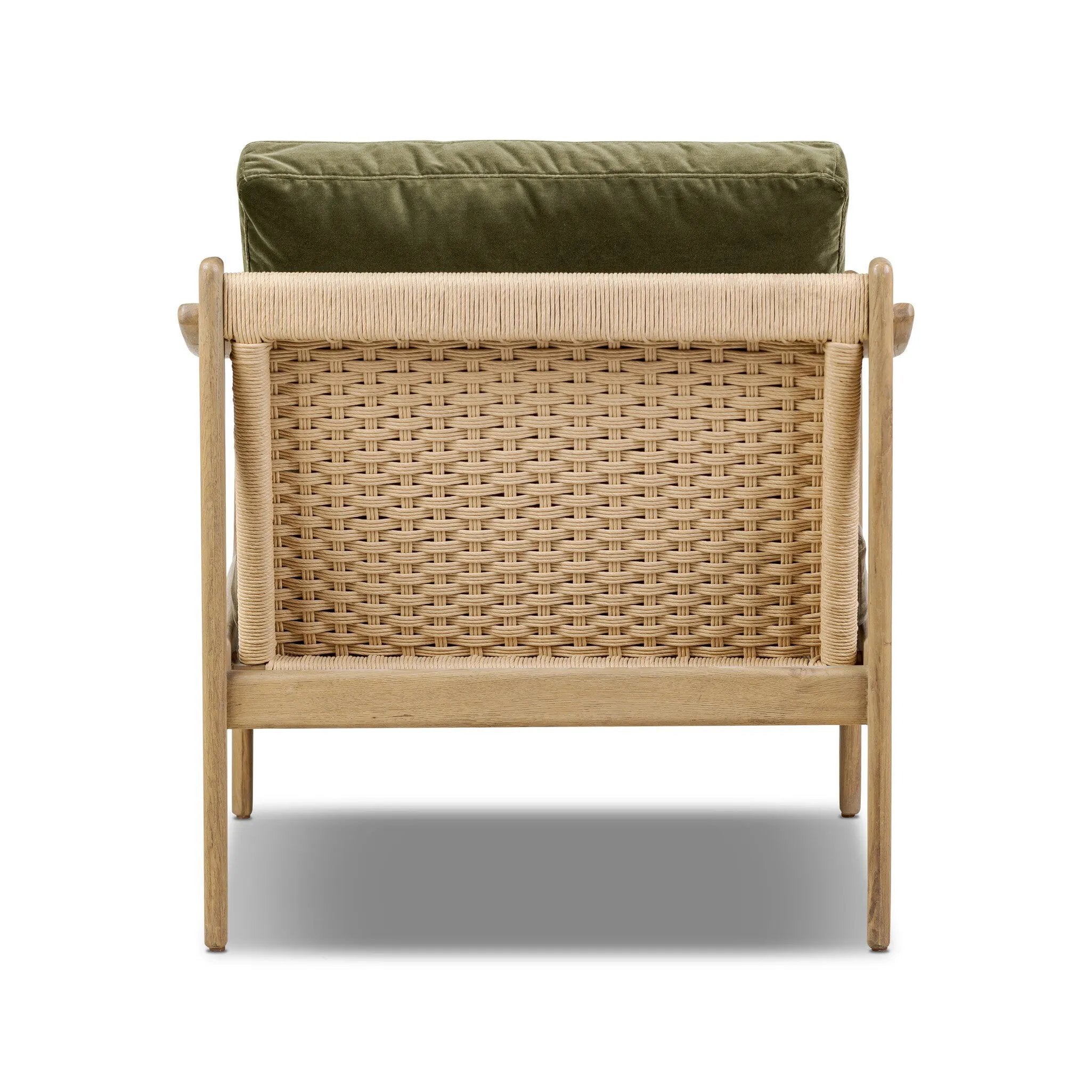 Tapered legs and sloped paddle arms frame the visible joinery and handwoven rope details of this accent chair, for a monochromatic yet visually intriguing frame. Finished with loose, velvet-upholstered seat and back cushions in a rich olive hue — for a subtle color contrast that celebrates the natural beauty of each material Amethyst Home provides interior design, new home construction design consulting, vintage area rugs, and lighting in the Houston metro area.