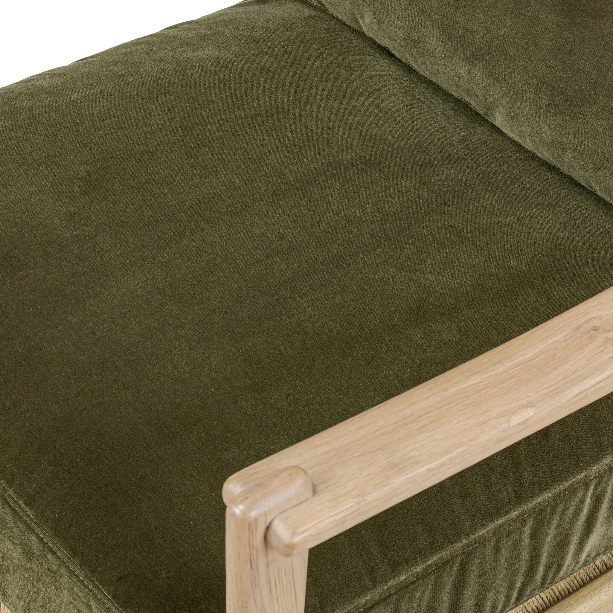 Tapered legs and sloped paddle arms frame the visible joinery and handwoven rope details of this accent chair, for a monochromatic yet visually intriguing frame. Finished with loose, velvet-upholstered seat and back cushions in a rich olive hue — for a subtle color contrast that celebrates the natural beauty of each material Amethyst Home provides interior design, new home construction design consulting, vintage area rugs, and lighting in the San Diego metro area.