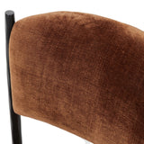 Bring a refreshed midcentury look — and pop of color — to your table. Comfortable seat and back cushions are upholstered in a velvety fabric with a soft, chenille-like feel, while slim, black-finished iron frame curves at the top to soften things up. Simple tapered legs complete the look. Amethyst Home provides interior design, new home construction design consulting, vintage area rugs, and lighting in the Omaha metro area.