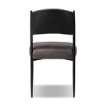Bring a refreshed midcentury look to your table. Comfortable seat and back cushions are upholstered in a black top-grain leather, with a slim iron frame curving at the top to soften things up. Simple tapered legs complete the look.As enthusiasts of natural aesthetics at Amethyst, we love the nature inspired Bellaire Dining Chair - Palermo Black. Amethyst Home provides interior design, new home construction design consulting, vintage area rugs, and lighting in the Calabasas metro area.