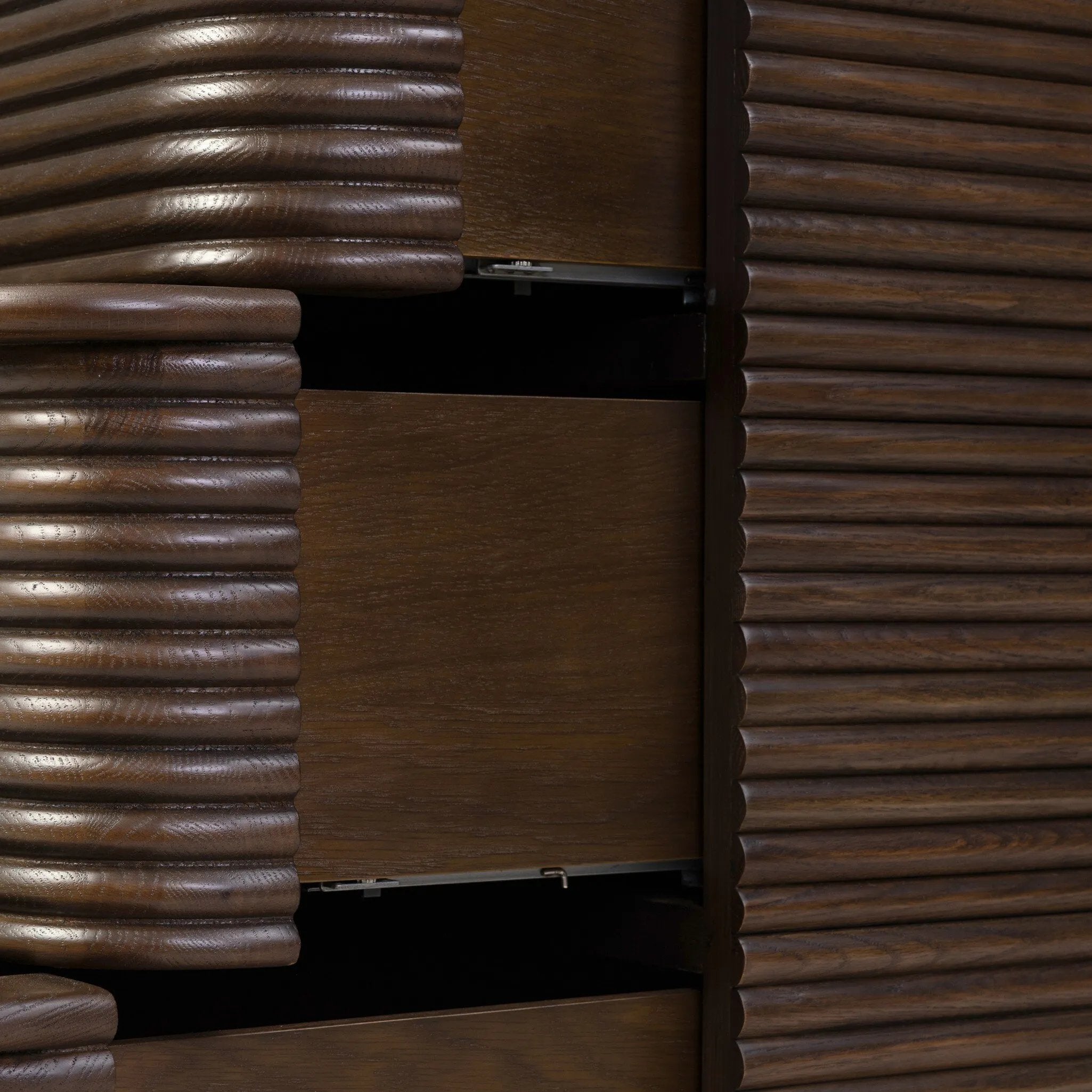 Inspired by aerodynamic-inspired Streamline Moderne style, stacked scalloped reeding wraps this spiced oak dresser with six spacious drawers. The result: a beautifully rhythmic, repeated look. With integrated hardware for a clean finish.As fans of natural materials at Amethyst, we love the nature inspired Benny 6 Drawer Dresser - Spiced Oak Veneer. Amethyst Home provides interior design, new home construction design consulting, vintage area rugs, and lighting in the Park City metro area.