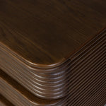 Inspired by aerodynamic-inspired Streamline Moderne style, stacked scalloped reeding wraps this spiced oak nightstand. The result: a beautifully rhythmic, repeated look. With integrated hardware for a clean finish.As lovers of modern aesthetics at Amethyst, we love the warm modern inspired Benny Nightstand - Spiced Oak Veneer. Amethyst Home provides interior design, new home construction design consulting, vintage area rugs, and lighting in the Seattle metro area.