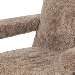 A large, comfort-driven desk chair of taupe shearling tops a 360-degree swivel, for a luxurious take on office styling Amethyst Home provides interior design, new home construction design consulting, vintage area rugs, and lighting in the Houston metro area.