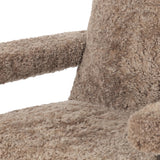 A large, comfort-driven desk chair of taupe shearling tops a 360-degree swivel, for a luxurious take on office styling Amethyst Home provides interior design, new home construction design consulting, vintage area rugs, and lighting in the Houston metro area.