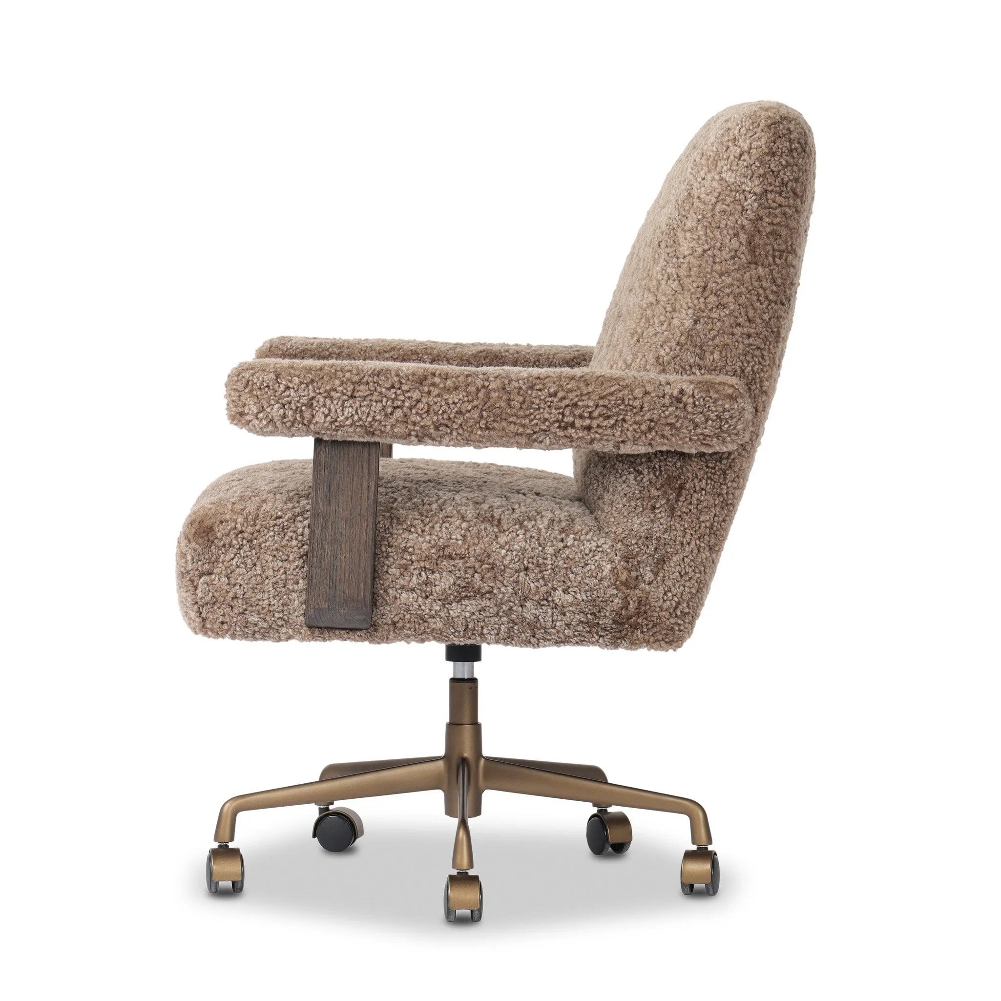 A large, comfort-driven desk chair of taupe shearling tops a 360-degree swivel, for a luxurious take on office styling Amethyst Home provides interior design, new home construction design consulting, vintage area rugs, and lighting in the Seattle metro area.