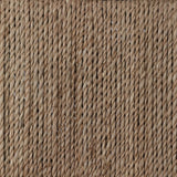 A steel dining chair frame is softened and paired with natural woven fibers. Thin, tapered legs and a tall channeled back cre