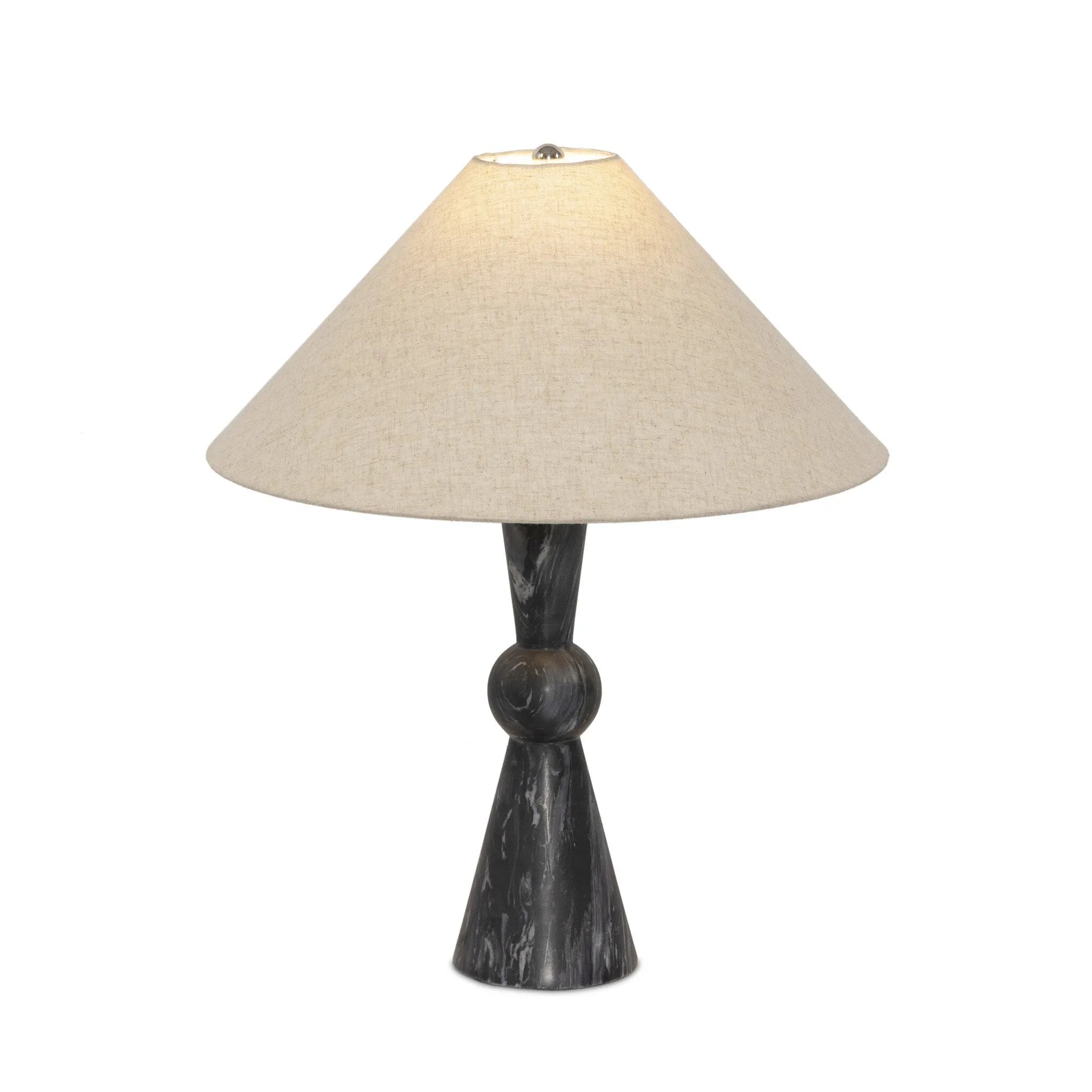 Polished forms define this sculptural table lamp, featuring a base of black Italian marble with distinctive white veining and a tapered flax linen shade.Collection: Ashe Amethyst Home provides interior design, new home construction design consulting, vintage area rugs, and lighting in the Houston metro area.