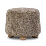 For an extra seat or propped feet, this welcoming ottoman features a subtly tapered shape and a rounded base with bun feet beneath. Crafted from solid oak and upholstered with taupe shearling for extra texture Amethyst Home provides interior design, new home construction design consulting, vintage area rugs, and lighting in the Houston metro area.