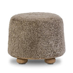 For an extra seat or propped feet, this welcoming ottoman features a subtly tapered shape and a rounded base with bun feet beneath. Crafted from solid oak and upholstered with taupe shearling for extra texture Amethyst Home provides interior design, new home construction design consulting, vintage area rugs, and lighting in the Omaha metro area.