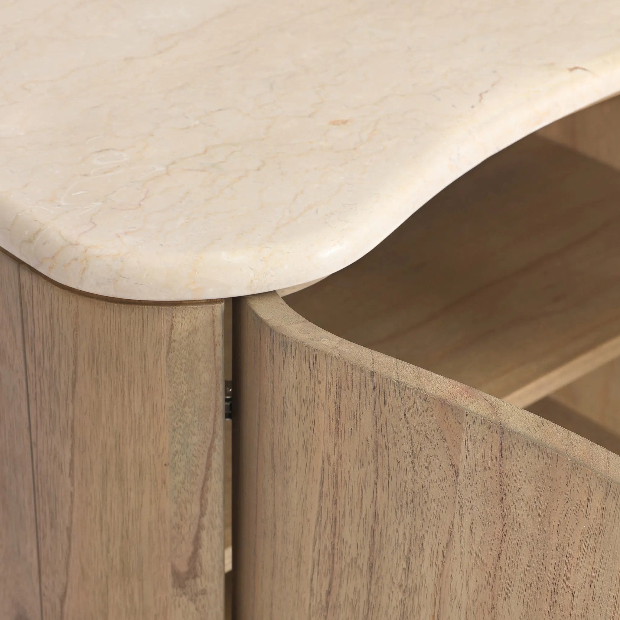 Fluid contours give shape to this solid mindi nightstand, topped with a creamy marbled top. Two doors with knobbed pulls open to inset shelves for organized bedside storage Amethyst Home provides interior design, new home construction design consulting, vintage area rugs, and lighting in the Dallas metro area.