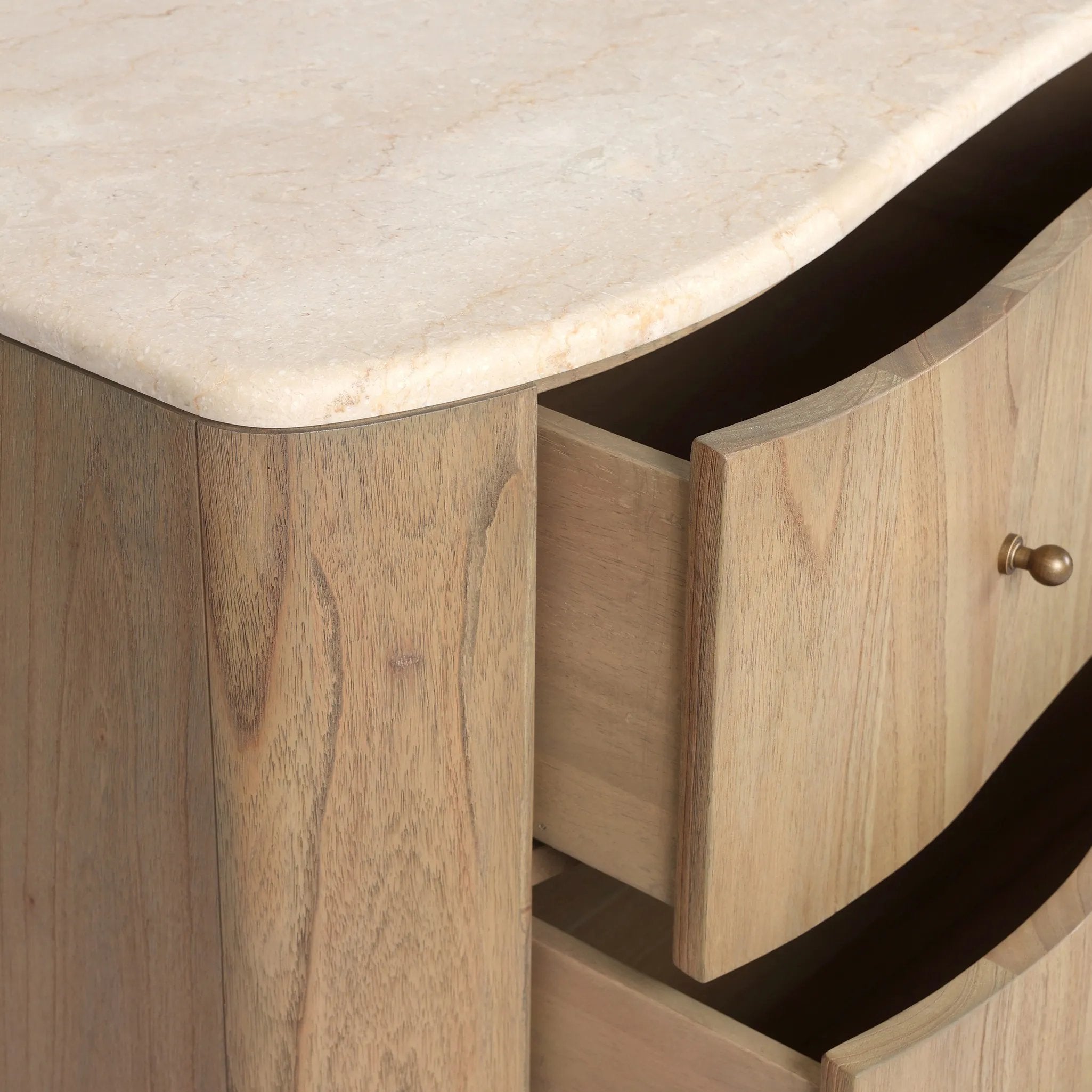 Fluid contours give shape to this solid mindi dresser, topped with a creamy marbled top. Six drawers with knobbed pulls open to spacious drawers Amethyst Home provides interior design, new home construction design consulting, vintage area rugs, and lighting in the Houston metro area.