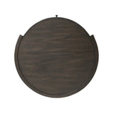 Rich contours bring character to the bedside. A round black-finished oak table has a spacious cubby and a single drawer with metal glides and a bronzed pull Amethyst Home provides interior design, new home construction design consulting, vintage area rugs, and lighting in the Kansas City metro area.