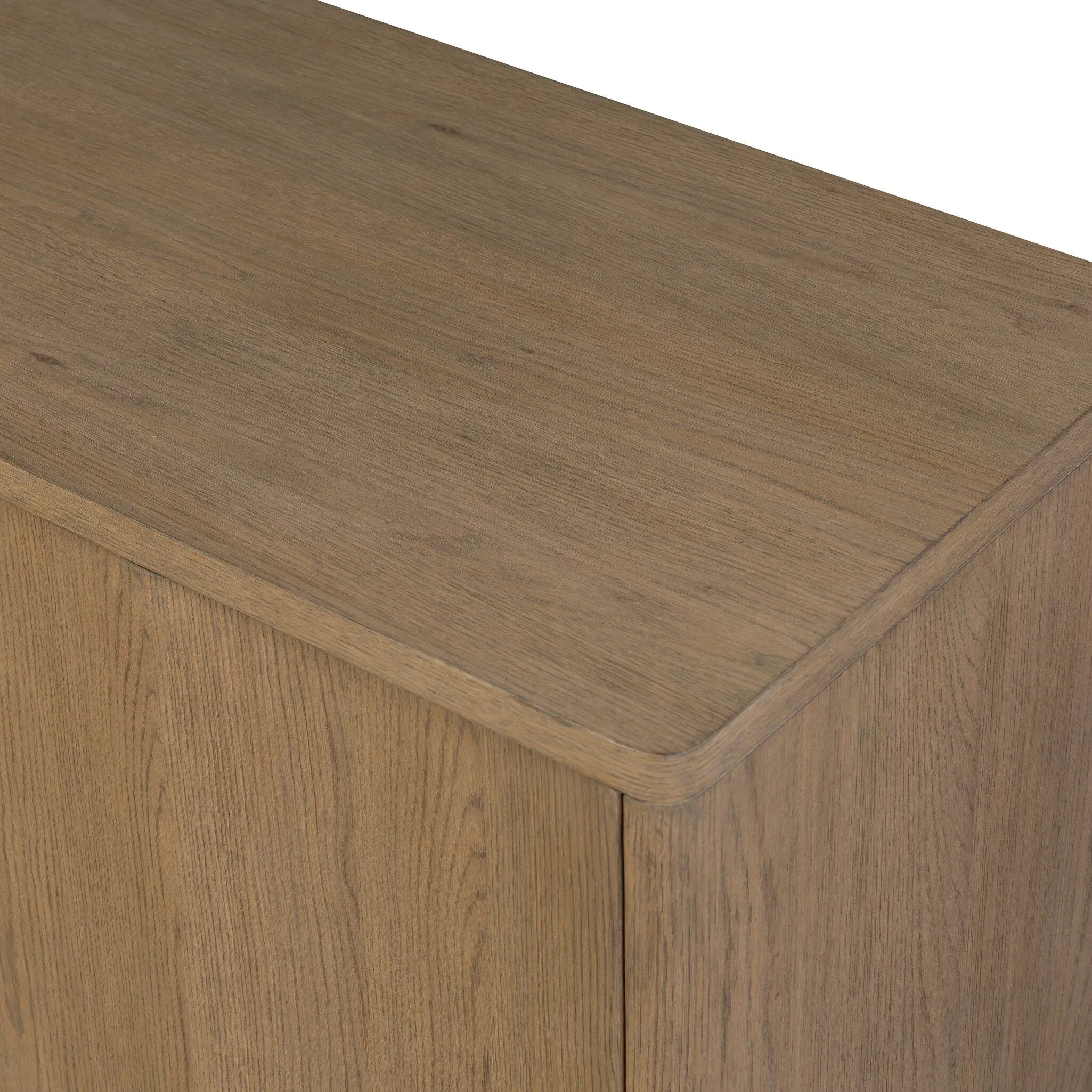 The traditional media console, reimagined. This warm oak piece features two sets of doors with shallow scalloping that draws the eye, providing a subtle visual flow. Rear cutouts for cord management.As lovers of natural aesthetics at Amethyst, we love the designer inspired Brookhurst Media Console - Drifted Oak Veneer. Amethyst Home provides interior design, new home construction design consulting, vintage area rugs, and lighting in the Austin metro area.