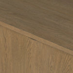 The traditional media console, reimagined. This warm oak piece features two sets of doors with shallow scalloping that draws the eye, providing a subtle visual flow. Rear cutouts for cord management.As lovers of natural aesthetics at Amethyst, we love the designer inspired Brookhurst Media Console - Drifted Oak Veneer. Amethyst Home provides interior design, new home construction design consulting, vintage area rugs, and lighting in the Laguna Beach metro area.