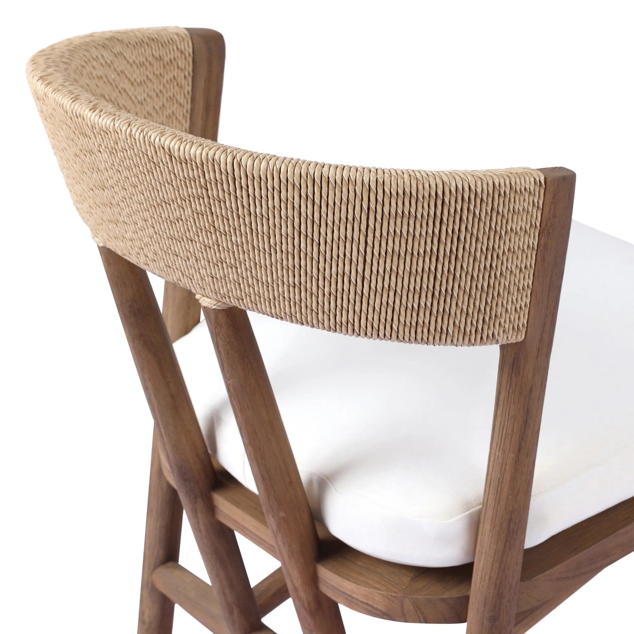 Featuring Buxton Arashi Salt Outdoor Dining Chair by Four Hands at Amethyst Home. The traditional whistler chair, reimagined for the great outdoors. Crafted from FSC®-certified teak, tapered legs extend to a woven back of faux hyacinth, complete with a soft, durable seat cushion. Cover or store indoors during inclement weather and when not in use. Overall Dim. Amethyst Home provides interior design, new home construction design consulting, vintage area rugs, and lighting in the Houston metro area.