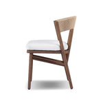 Featuring Buxton Arashi Salt Outdoor Dining Chair by Four Hands at Amethyst Home. The traditional whistler chair, reimagined for the great outdoors. Crafted from FSC®-certified teak, tapered legs extend to a woven back of faux hyacinth, complete with a soft, durable seat cushion. Cover or store indoors during inclement weather and when not in use. Overall Dimen. Amethyst Home provides interior design, new home construction design consulting, vintage area rugs, and lighting in the Omaha metro area.