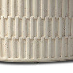 Cast concrete shapes a drum-style outdoor coffee table, with a linear pattern layered for added texture. Finished with a parchment-like textural feel. Cover or store inside during inclement weather and when not in use.As lovers of wabi sabi design at Amethyst, we love the warm modern inspired Callisto Outdoor Coffee Table - Aged White Concrete. Amethyst Home provides interior design, new home construction design consulting, vintage area rugs, and lighting in the Laguna Beach metro area.