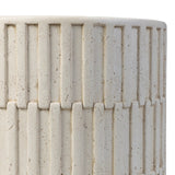 Cast concrete shapes a drum-style outdoor end table, with a linear pattern layered for added texture. Finished with a parchment-like textural feel. Cover or store inside during inclement weather and when not in use.As enthusiasts of luxe style at Amethyst, we love the optimistic inspired Callisto Outdoor End Table - Aged White Concrete. Amethyst Home provides interior design, new home construction design consulting, vintage area rugs, and lighting in the Los Angeles metro area.