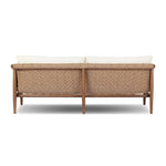 Featuring Cambrie Arashi Salt Outdoor Sofa 76" by Four Hands at Amethyst Home. Bring home vintage inspiration. The sling shape of this outdoor sofa features a reimagined bucket seat in woven faux hyacinth, finished with rounded tapered legs that mirror the shape of the frame. Cover or store indoors during inclement weather and when not in use. Overall D. Amethyst Home provides interior design, new home construction design consulting, vintage area rugs, and lighting in the Newport Beach metro area.