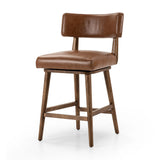 Featuring Cardell Sonoma Chestnut Swivel Bar + Counter Stool by Four Hands at Amethyst Home. This reimagined classic pairs a barrel back frame of solid nettlewood with top-grain leather in a rich chestnut. A 180-degree swivel with return memory tops off the piece with fresh functionality.BarOverall Dimensions: 21.50"w x 22.25"d x 42.50"hWeight: 24.25 lbs. Amethyst Home provides interior design, new home construction design consulting, vintage area rugs, and lighting in the Laguna Beach metro area.