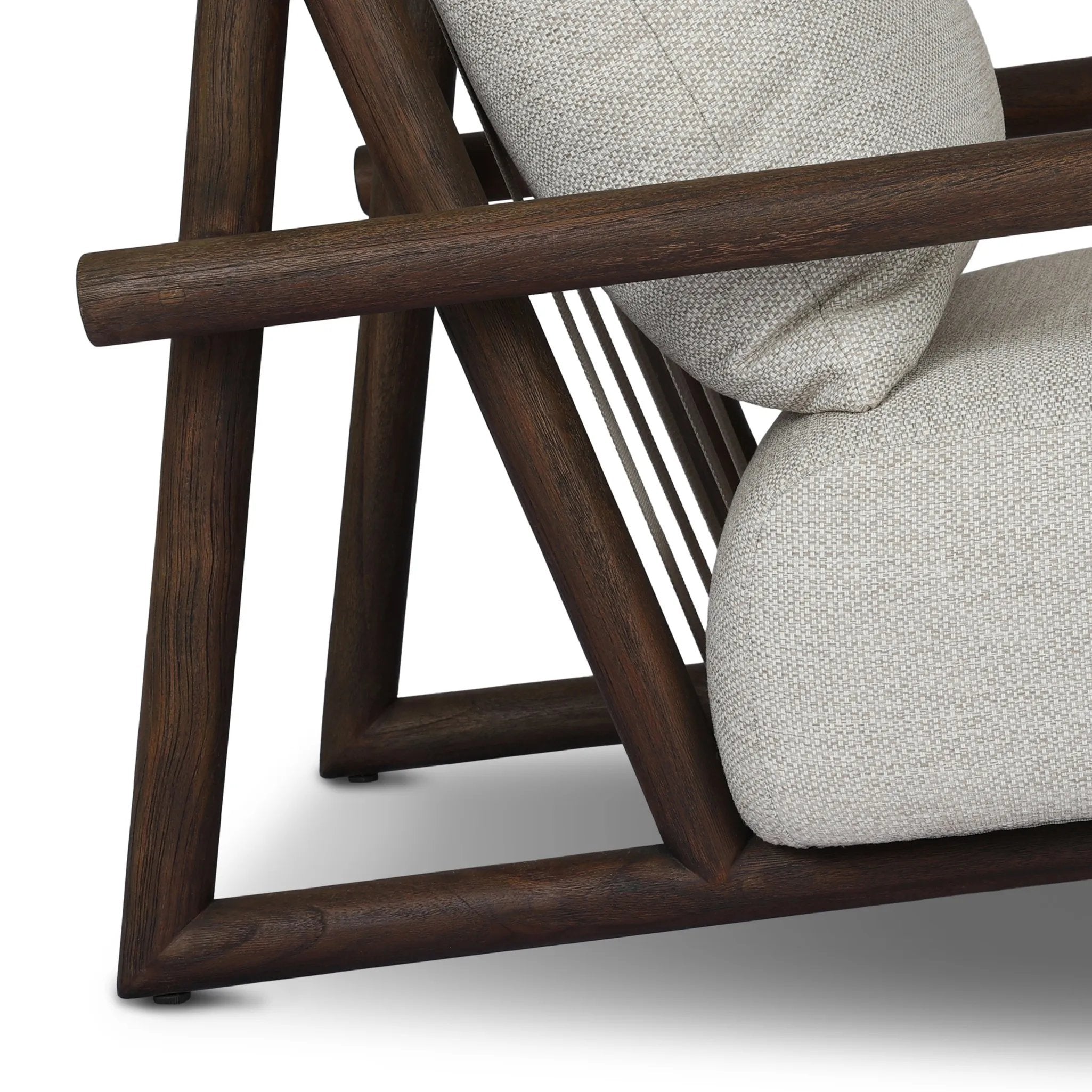 Featuring Cardiff Faye Sand Outdoor Chair by Four Hands at Amethyst Home. Angular FSC®-certified teak framing paired with softened dowel edges crafts a bench-made, transitional outdoor chair. Strap detailing supports the loose, knife-edge back cushion, complemented by a heavy fixed seat cushion — adding a touch of weight to the airy design. Cover or store indo. Amethyst Home provides interior design, new home construction design consulting, vintage area rugs, and lighting in the Dallas metro area.