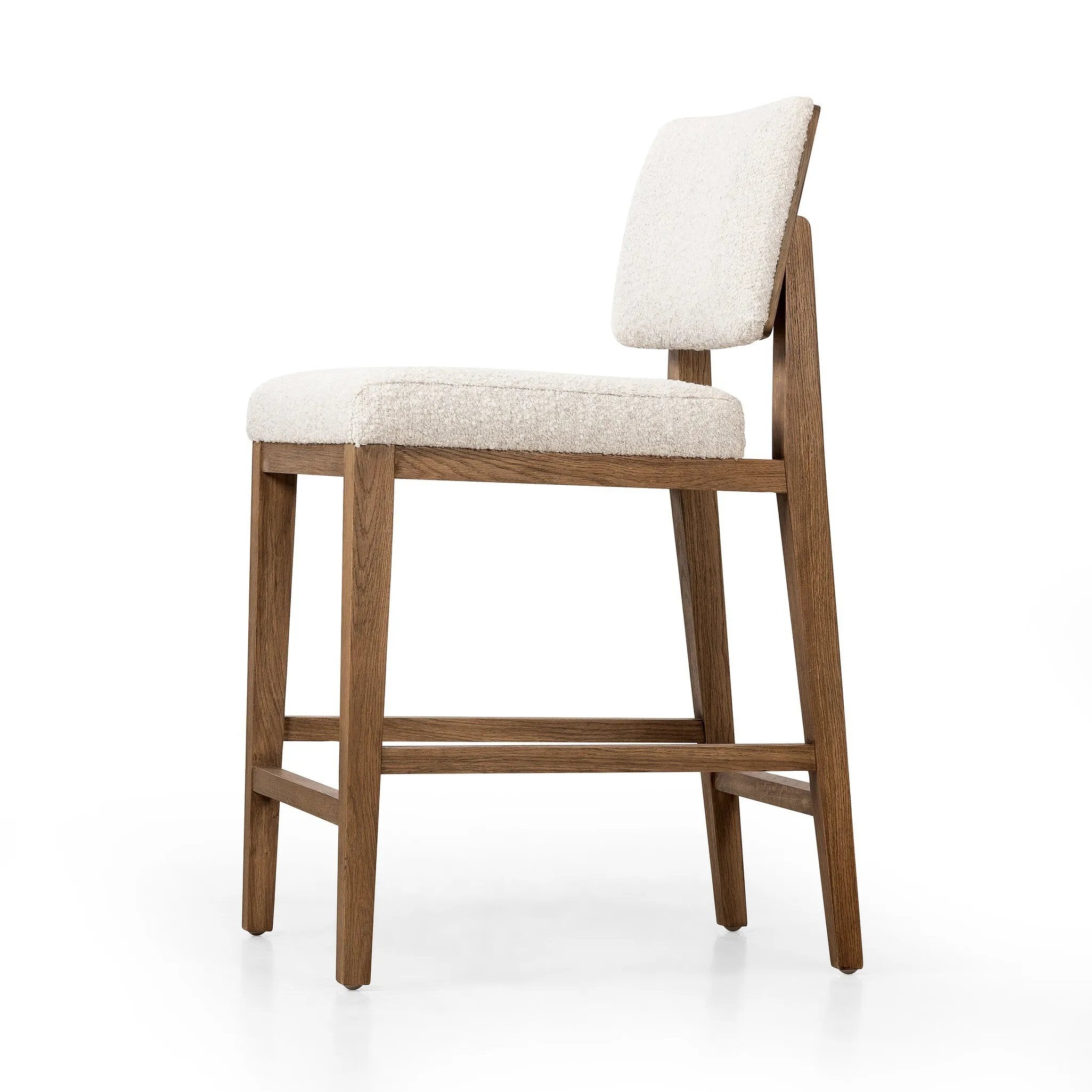 Featuring Charles Somerton Ash Counter Stool by Four Hands at Amethyst Home. This stool is all about the textile -- gorgeous French inspired boucle with a cool toned oak base.  Gorgeous back detail makes this Charles stool attractive from all angles.
Overall Dimensions: 25.5" L x 20.75 " W x 39.5" HClearance from Floor 16.75"Distance between Legs (Front to Bac. Amethyst Home provides interior design, new home construction design consulting, vintage area rugs, and lighting in the Boston metro area.