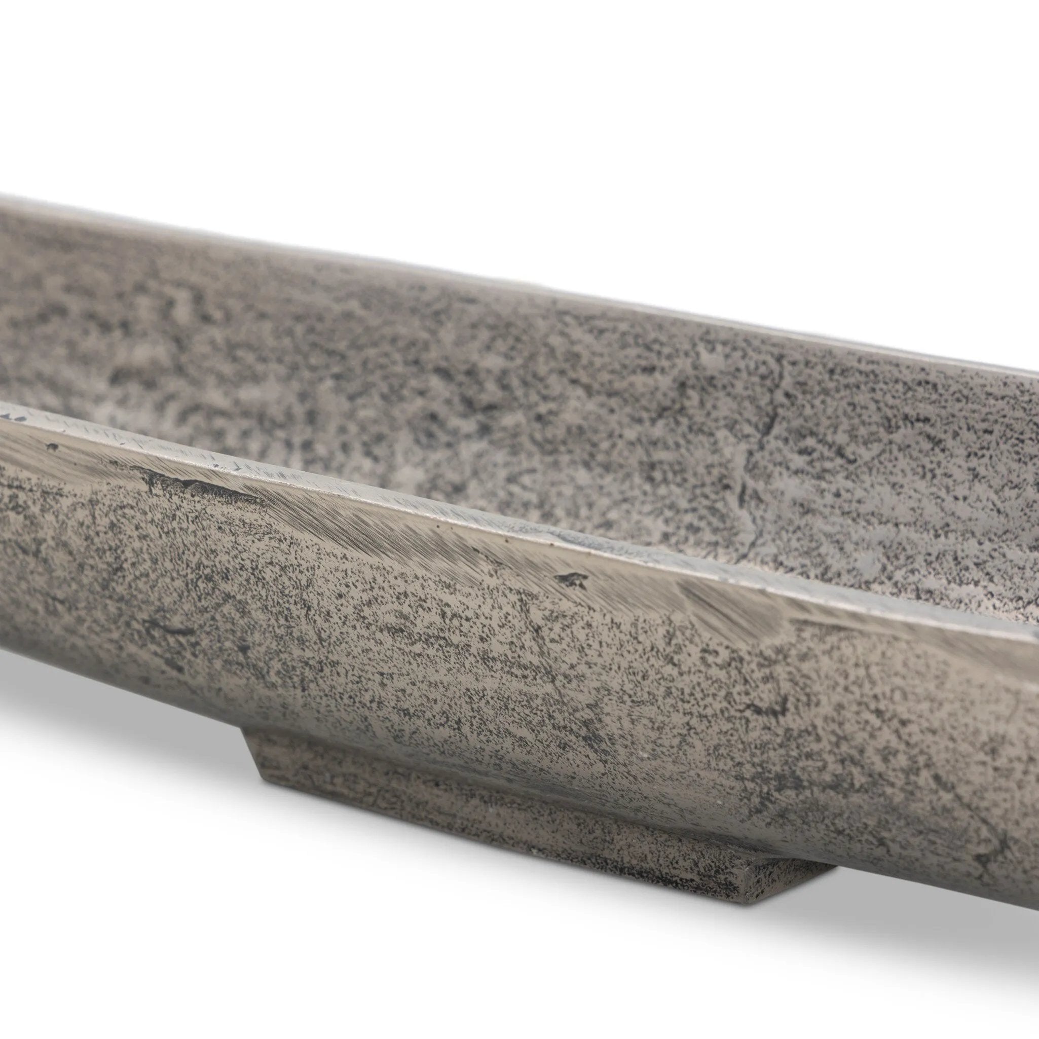 Statement-making centerpiece bowl featuring dramatic swooping lines, taking inspiration from Japanese fishing canoes. Cast in solid aluminum and supported by a single pedestal foot, giving the illusion that it's truly floating off the table.As lovers of clean design at Amethyst, we love the designer inspired Cerys Bowl - Raw Antique Nickel. Amethyst Home provides interior design, new home construction design consulting, vintage area rugs, and lighting in the Salt Lake City metro area.