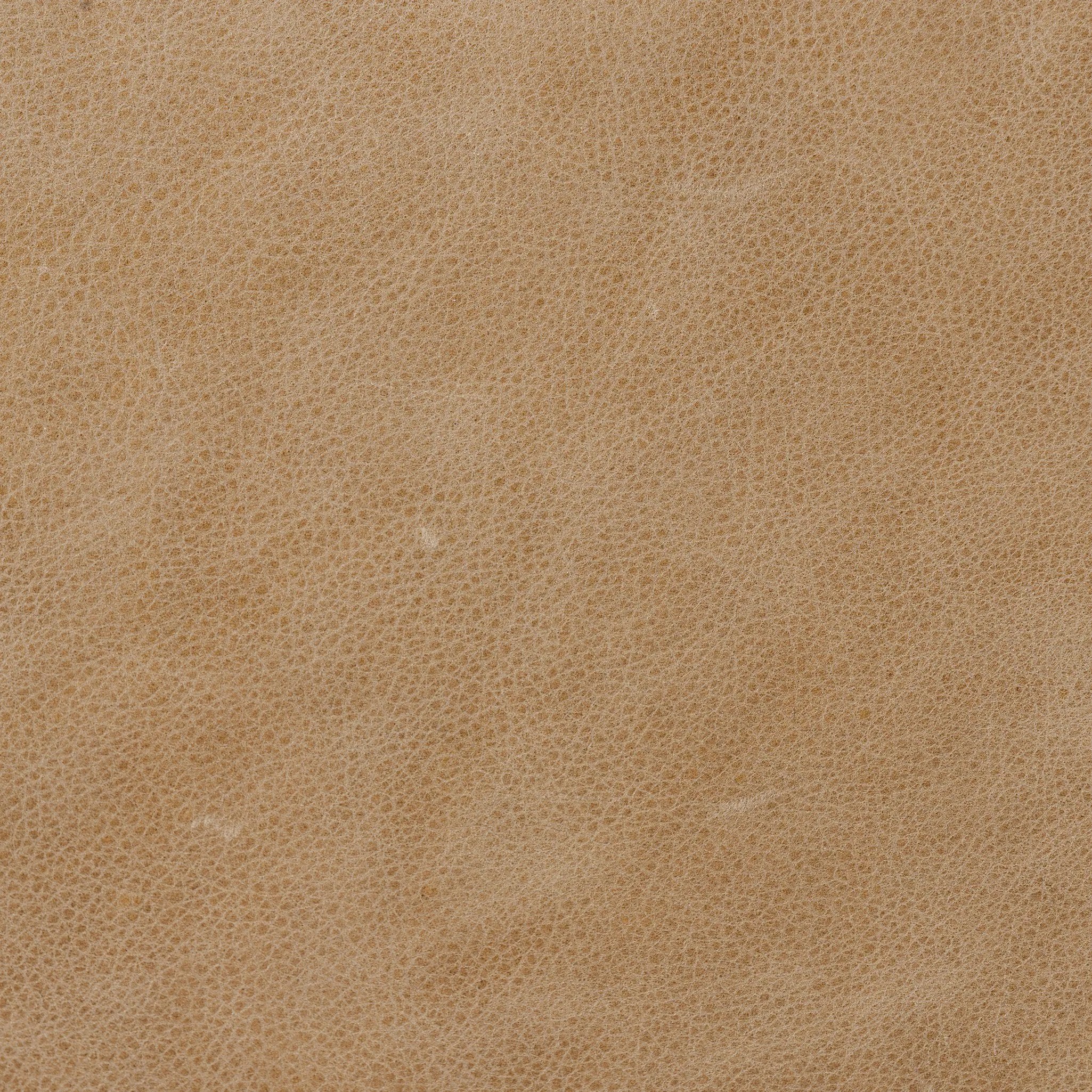 Meet modern comfort. Clean curves, impeccable tailoring and taupe top-grain leather with a pronounced grain bring an elevated, European-inspired look to this sofa Amethyst Home provides interior design, new home construction design consulting, vintage area rugs, and lighting in the Washington metro area.