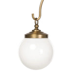 A chandelier inspired by Art Deco, featuring a pair of glass globes suspended from graciously curved iron arms finished in aged brass Amethyst Home provides interior design, new home construction design consulting, vintage area rugs, and lighting in the Park City metro area.