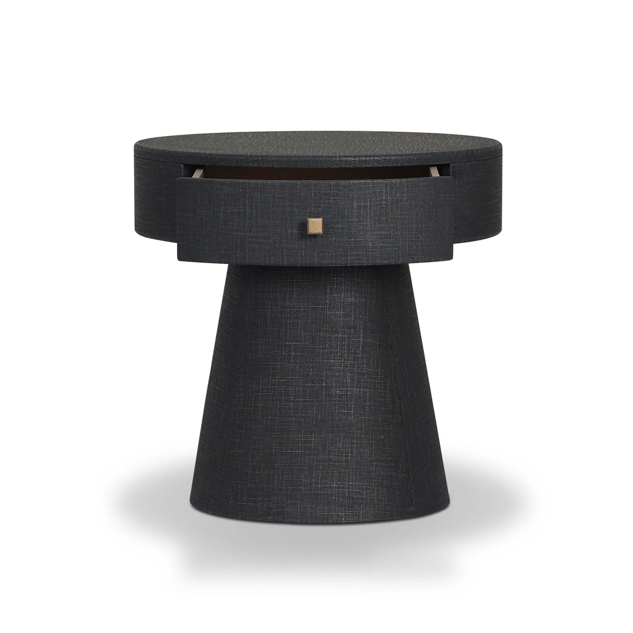 Wrapped in black painted linen, a rounded nightstand features a single drawer and tapered pedestal base, bringing texture plus storage to the bedside Amethyst Home provides interior design, new home construction design consulting, vintage area rugs, and lighting in the Charlotte metro area.