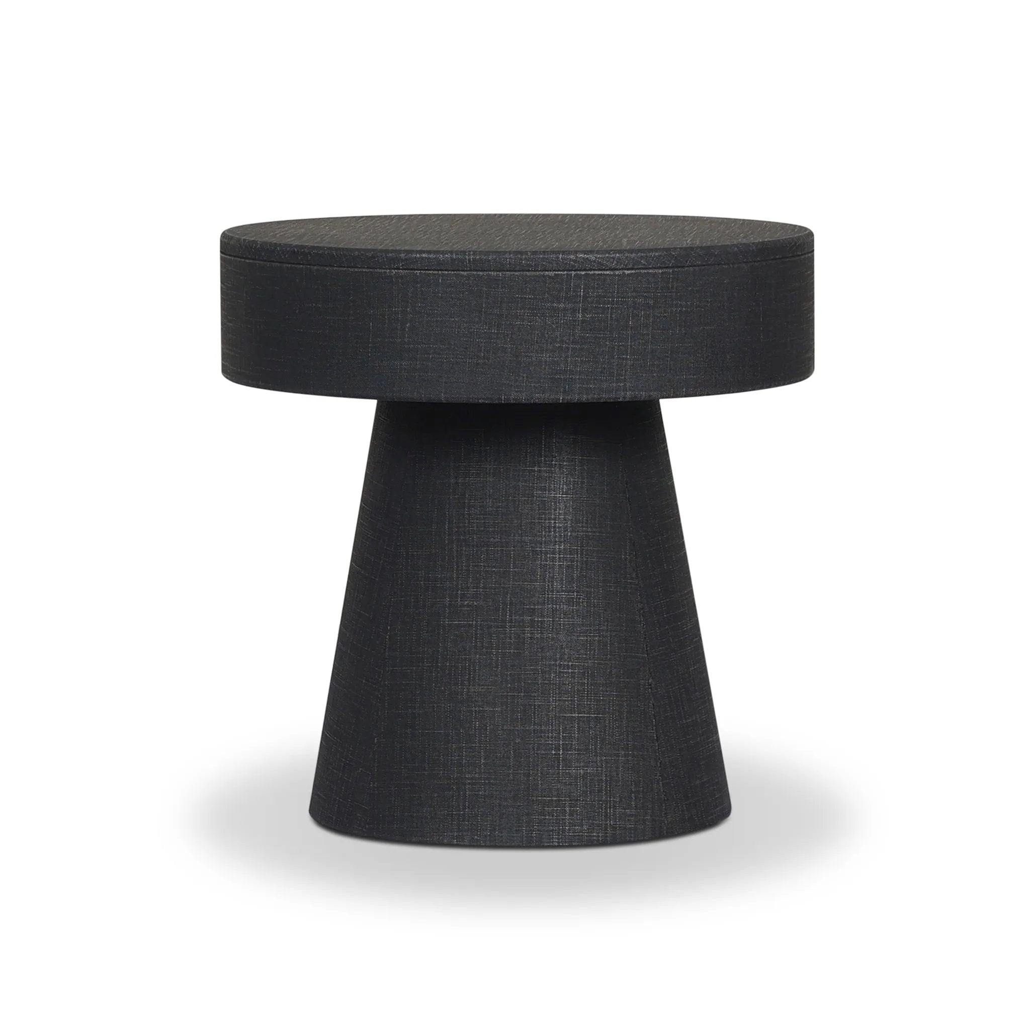 Wrapped in black painted linen, a rounded nightstand features a single drawer and tapered pedestal base, bringing texture plus storage to the bedside Amethyst Home provides interior design, new home construction design consulting, vintage area rugs, and lighting in the Seattle metro area.