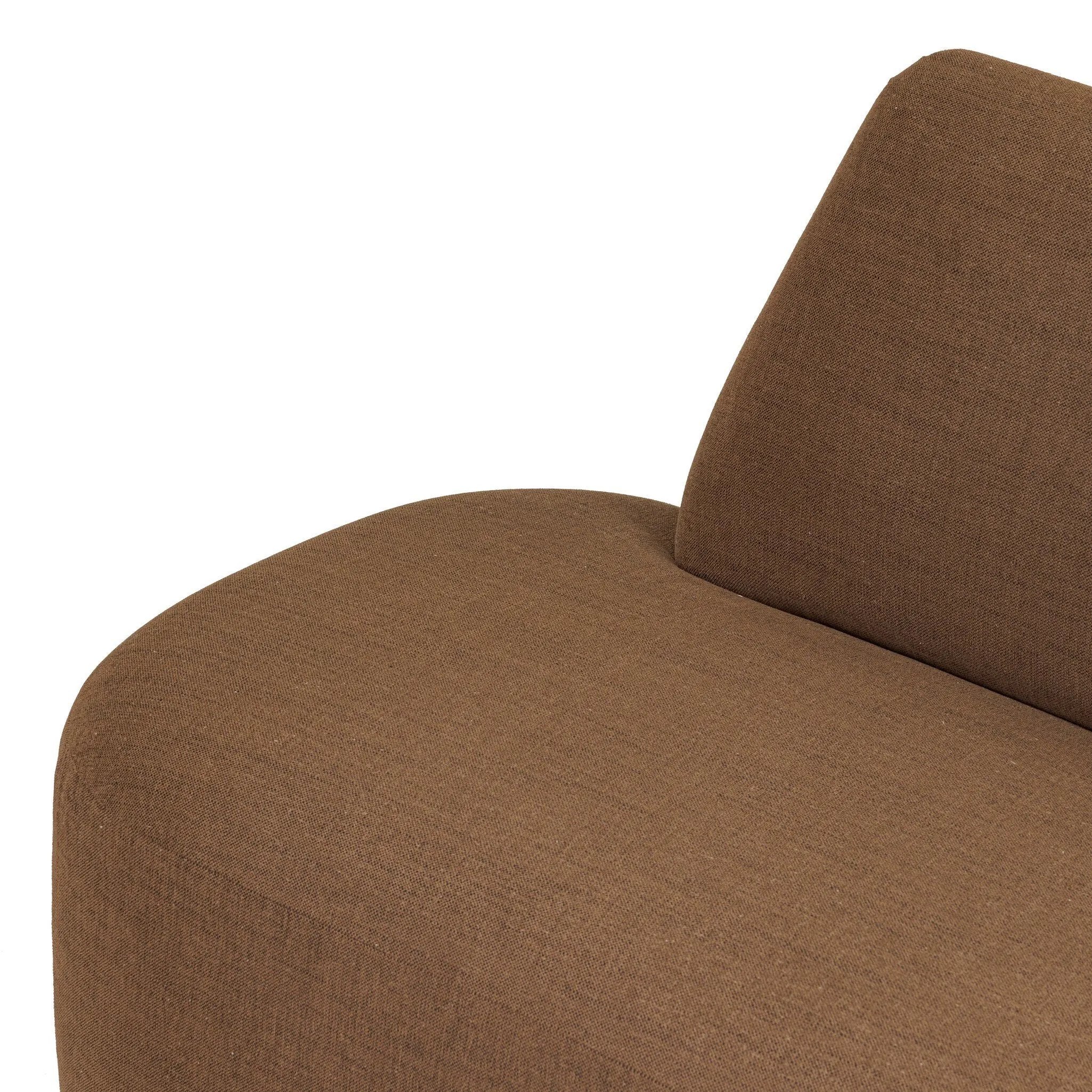 Dramatically shaped and tightly tailored, this rounded dining banquette features soft angles all around. Upholstered in a ver